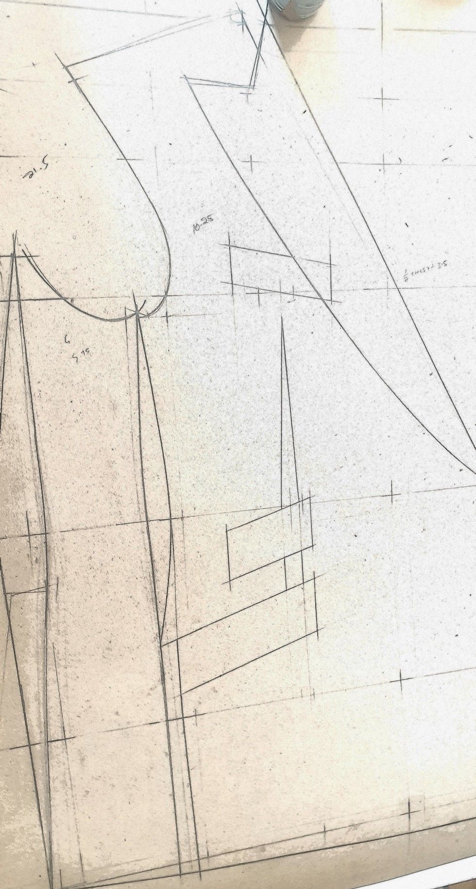 Pencil pattern-drafting lines on paper