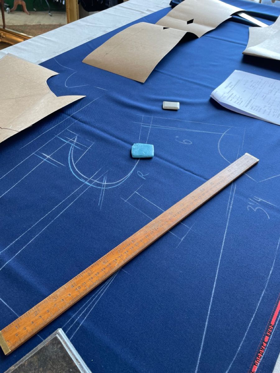 Chalk lines and a ruler on navy cloth